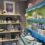 Cold Bath Road charity shop homeware shelves