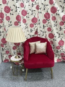 Red scallop back chair and cream lampshade
