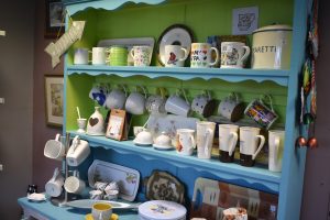Lime green and blue dresser with crockery in Saint Michael's Cold Bath Road shop