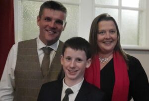 Dave, Tanya and Corey standing together smiling