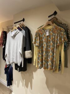 tops on display hangers in Boroughbridge charity shop
