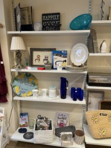 Homeware on shelves in Boroughbridge charity shop