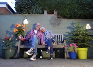 David and Jocelyn sat on a bench in the garden