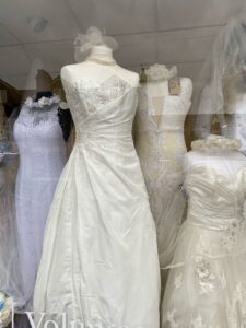 Secondhand wedding dresses in the window of our Starbeck charity shop