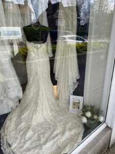 Wedding dresses in the window of our Leeds Road charity shop.