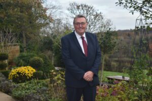 Tony Collins standing in the garden at Saint Michael's Hospice